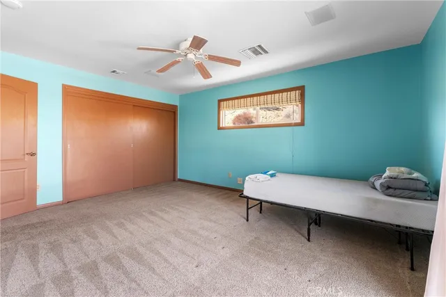 a room with pool table and window