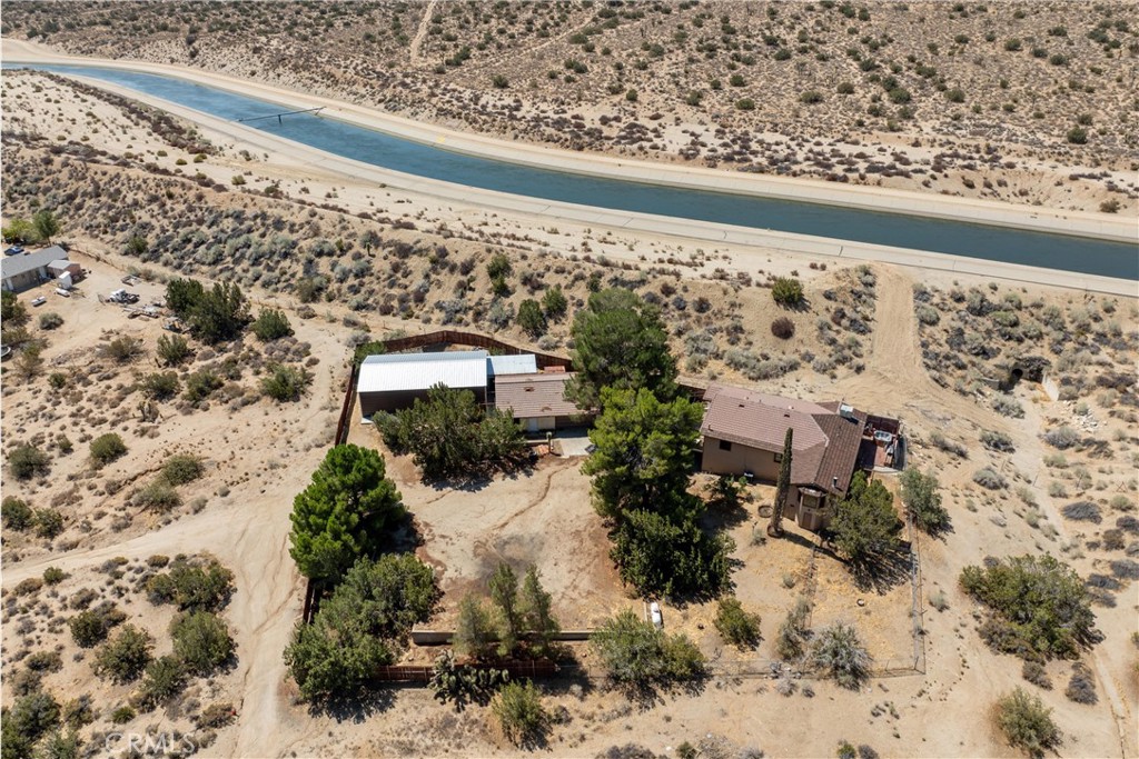 32451 Valyermo Road Pearblossom, CA 93553 - Photo 26 of 38 a view of a yard with wooden fence