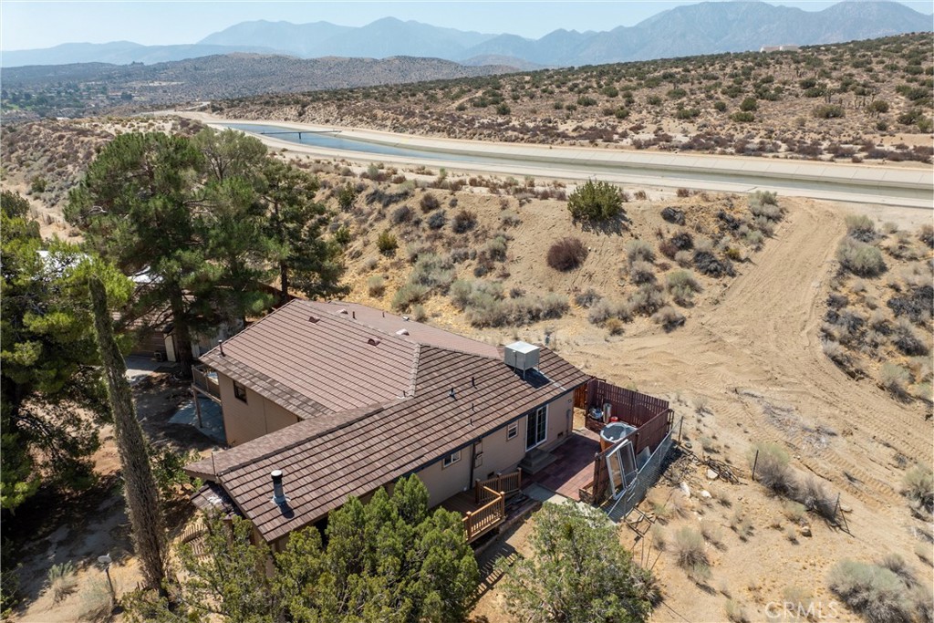 32451 Valyermo Road Pearblossom, CA 93553 - Photo 36 of 38 a view of a terrace with a bench