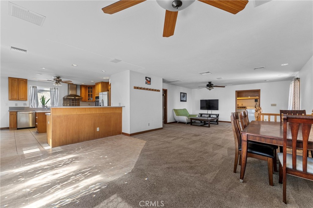 32451 Valyermo Road Pearblossom, CA 93553 - Photo 5 of 38 a view of a livingroom with furniture and a kitchen