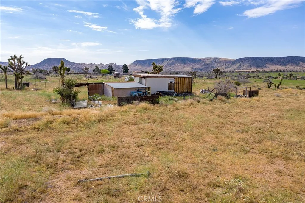 52550 Geronimo Road Pioneertown, CA 92268 - Photo 11 of 24 a view of a house with a mountain view