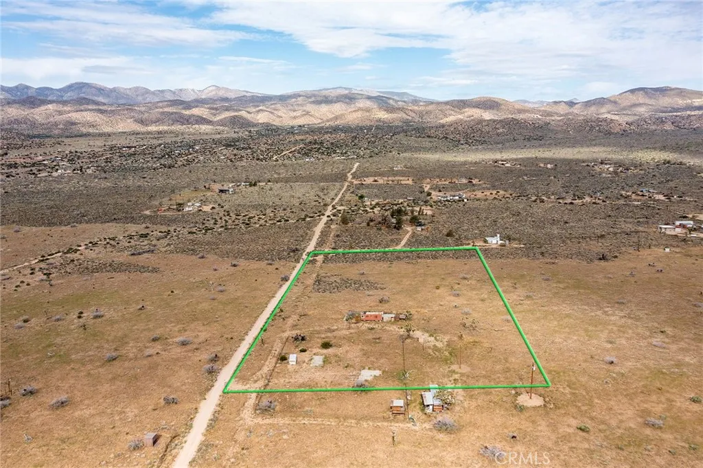 52550 Geronimo Road Pioneertown, CA 92268 - Photo 12 of 24 a view of a yard from a terrace