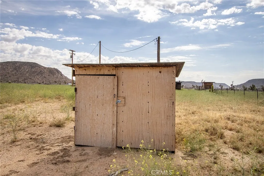 52550 Geronimo Road Pioneertown, CA 92268 - Photo 3 of 24 a view of a house with a backyard
