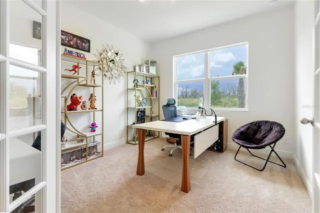 a view of a livingroom with furniture and a window