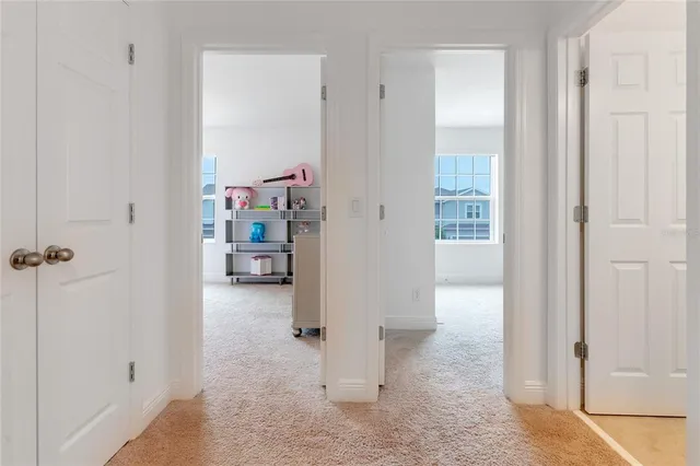 a view of a hallway with seating area