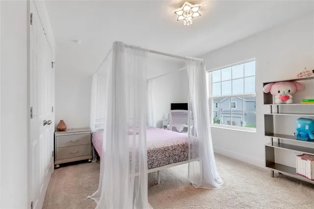 a bedroom with furniture and a chandelier