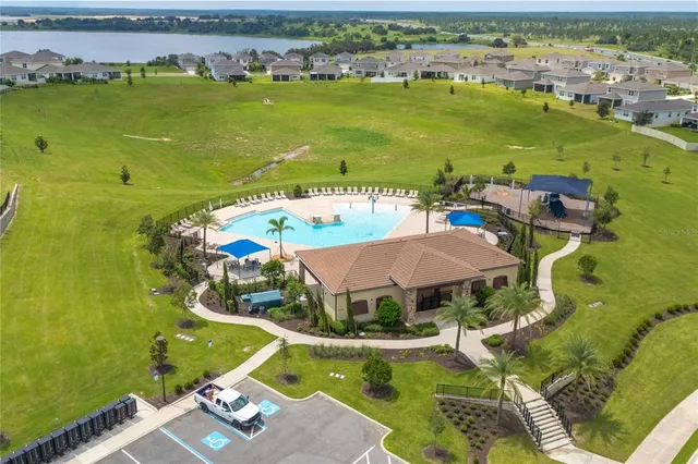 an aerial view of a house with a ocean view