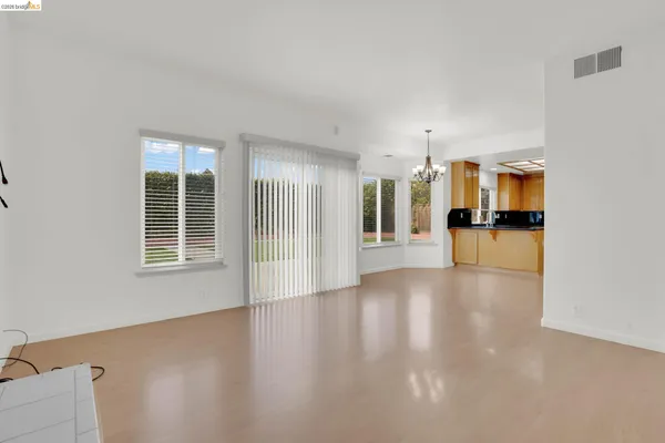 a kitchen with stainless steel appliances granite countertop a refrigerator a sink and a counter top