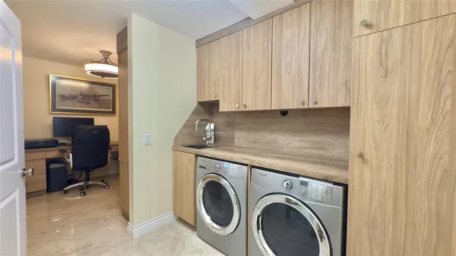 a view of storage and utility room with a washer and dryer