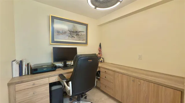 a view of workspace with wooden floor windows