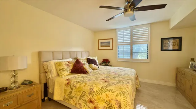 a bed room with a bed and a window