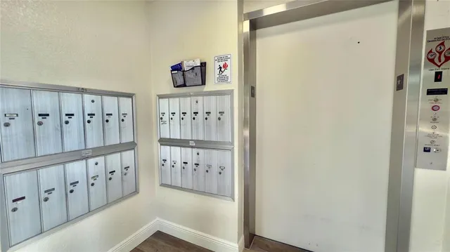 a view of a hallway with white walls