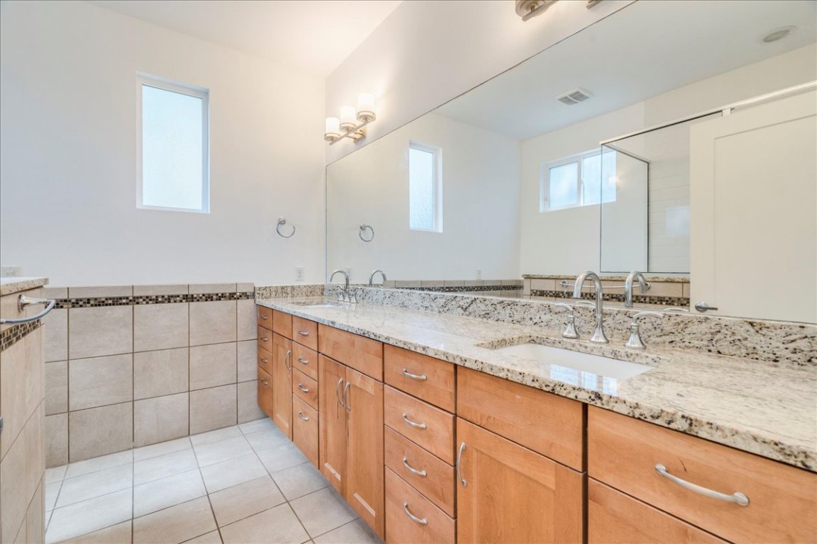 4006 Valley View Road, Unit B Austin, TX 78704 - Photo 9 of 32 a bathroom with a sink and a mirror