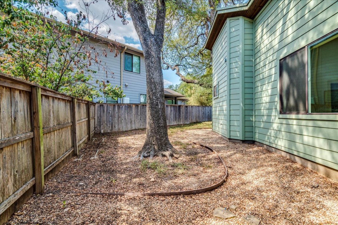 4006 Valley View Road, Unit B Austin, TX 78704 - Photo 21 of 32 a view of a backyard with wooden fence