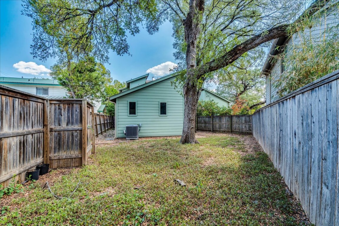 4006 Valley View Road, Unit B Austin, TX 78704 - Photo 24 of 32 a backyard of a house with plants and wooden fence