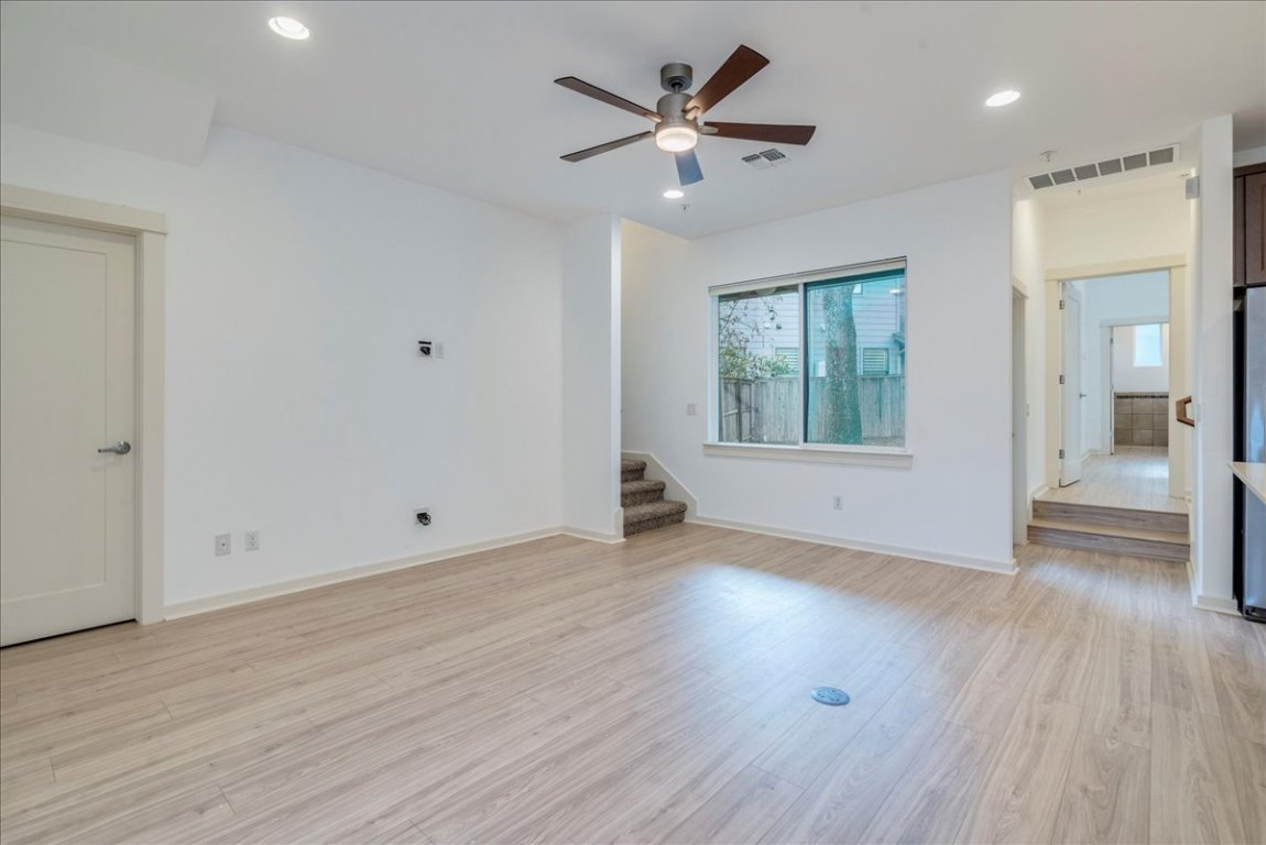 4006 Valley View Road, Unit B Austin, TX 78704 - Photo 31 of 32 an empty room with wooden floor and windows