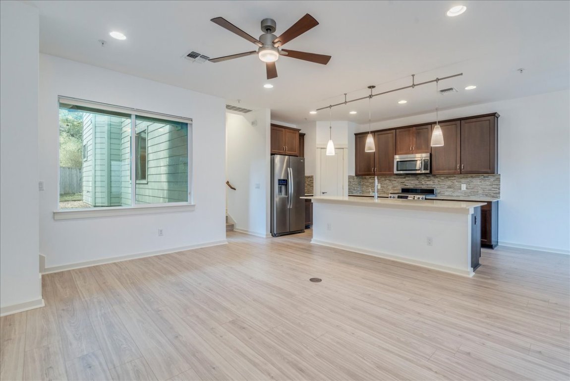 4006 Valley View Road, Unit B Austin, TX 78704 - Photo 5 of 32 a view of kitchen with kitchen island wooden floor center island and appliances