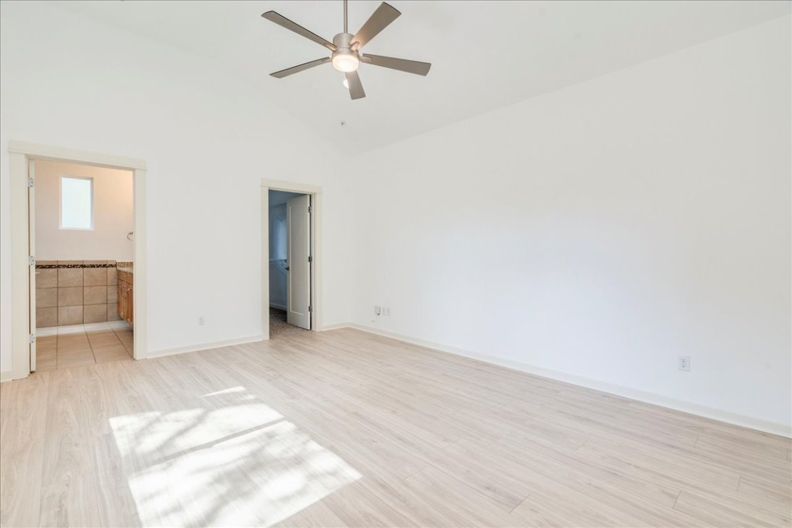 4006 Valley View Road, Unit B Austin, TX 78704 - Photo 7 of 32 an empty room with fan and entrance