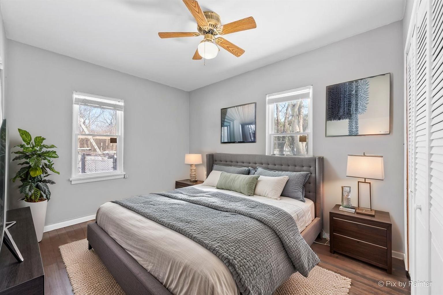 2629 North McAree Road Waukegan, IL 60087 - Photo 13 of 28 a bedroom with a bed and a potted plant