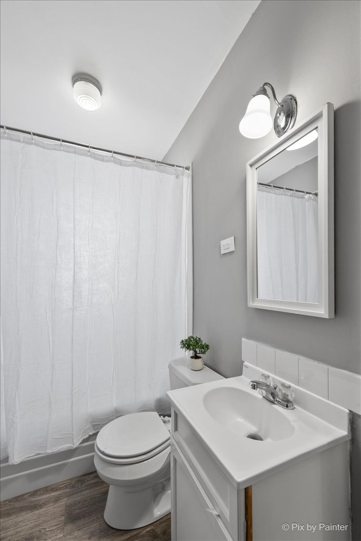 2629 North McAree Road Waukegan, IL 60087 - Photo 17 of 28 a bathroom with a sink a toilet and mirror
