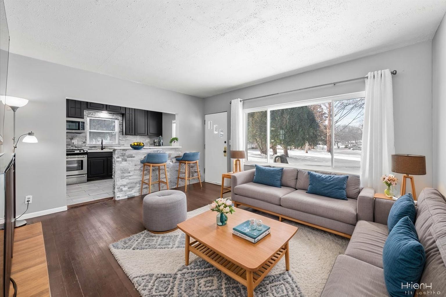 2629 North McAree Road Waukegan, IL 60087 - Photo 5 of 28 a living room with furniture a large window and a table