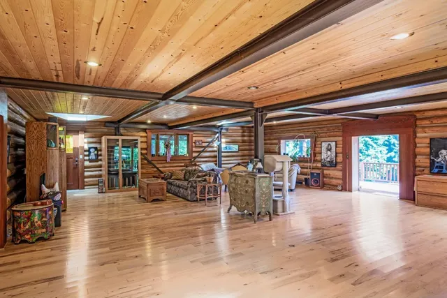 a view of deck with wooden floor and outdoor seating