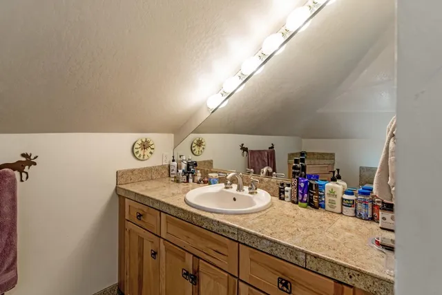 a view of a backyard with swimming pool