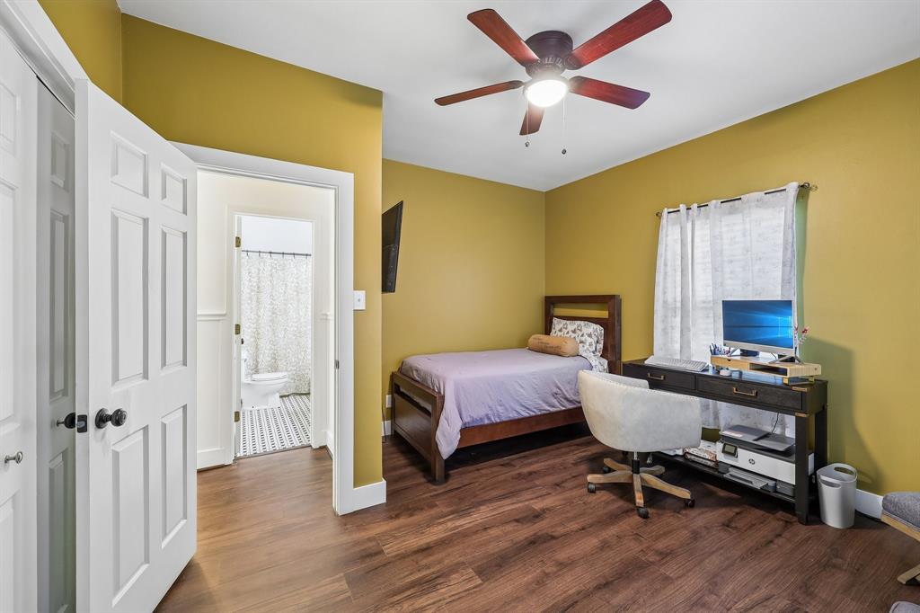 331 Radecke Road Krum, TX 76249 - Photo 26 of 40 Room with wood-finish flooring, a ceiling fan, and a window with white curtains