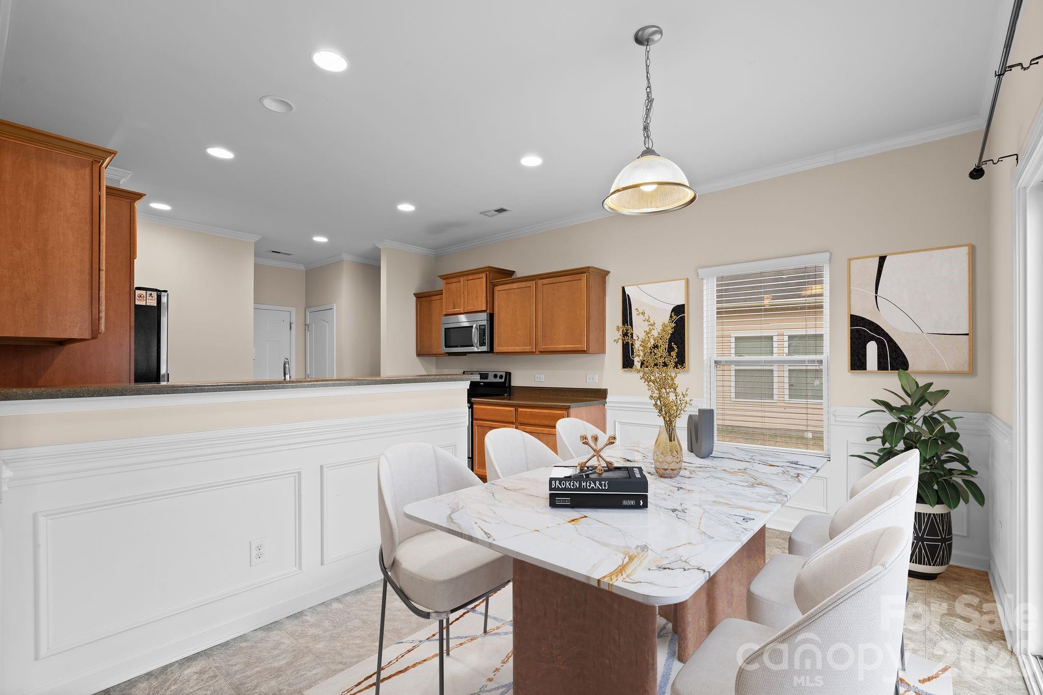 13718 Porter Creek Road Charlotte, NC 28262 - Photo 14 of 45 a kitchen with a table and chairs in it