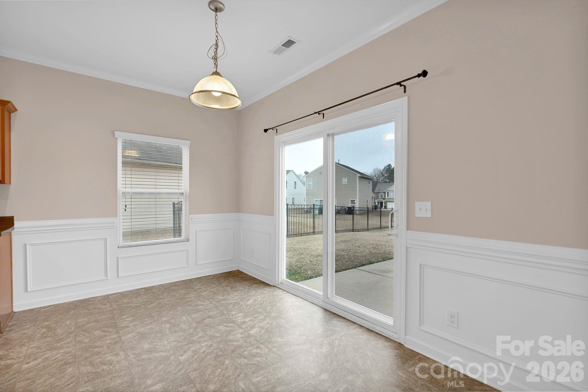 13718 Porter Creek Road Charlotte, NC 28262 - Photo 15 of 45 a view of an empty room with a window