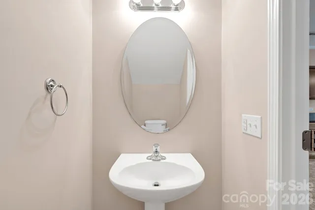 a bathroom with a sink and mirror