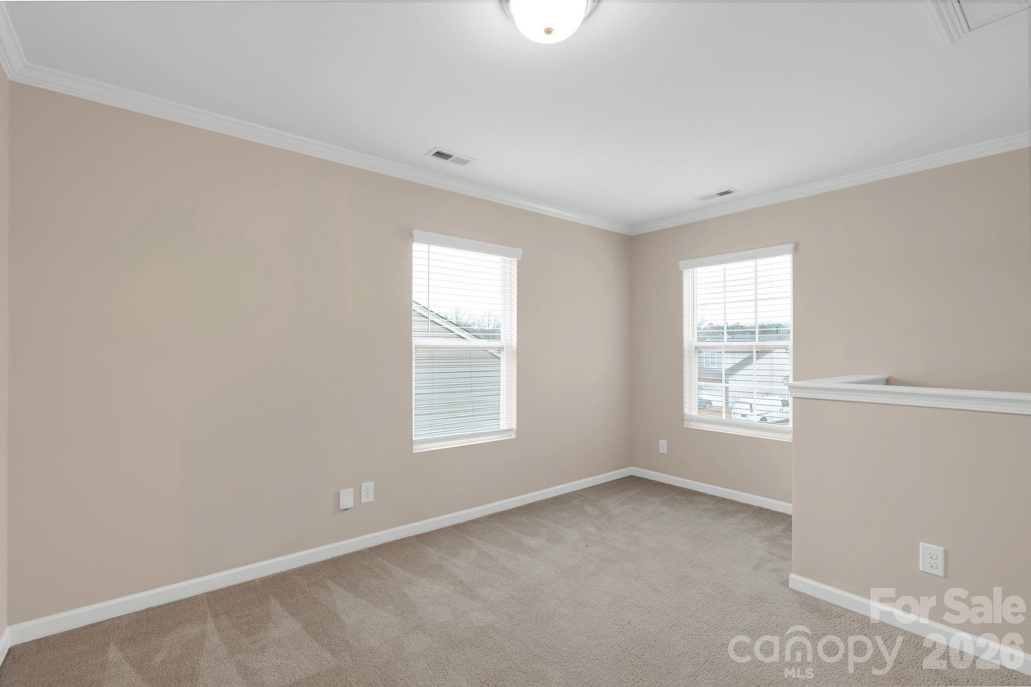 13718 Porter Creek Road Charlotte, NC 28262 - Photo 21 of 45 a view of an empty room with a window