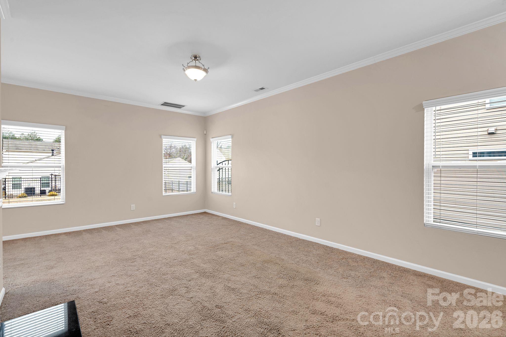 13718 Porter Creek Road Charlotte, NC 28262 - Photo 24 of 45 a view of an empty room with a window