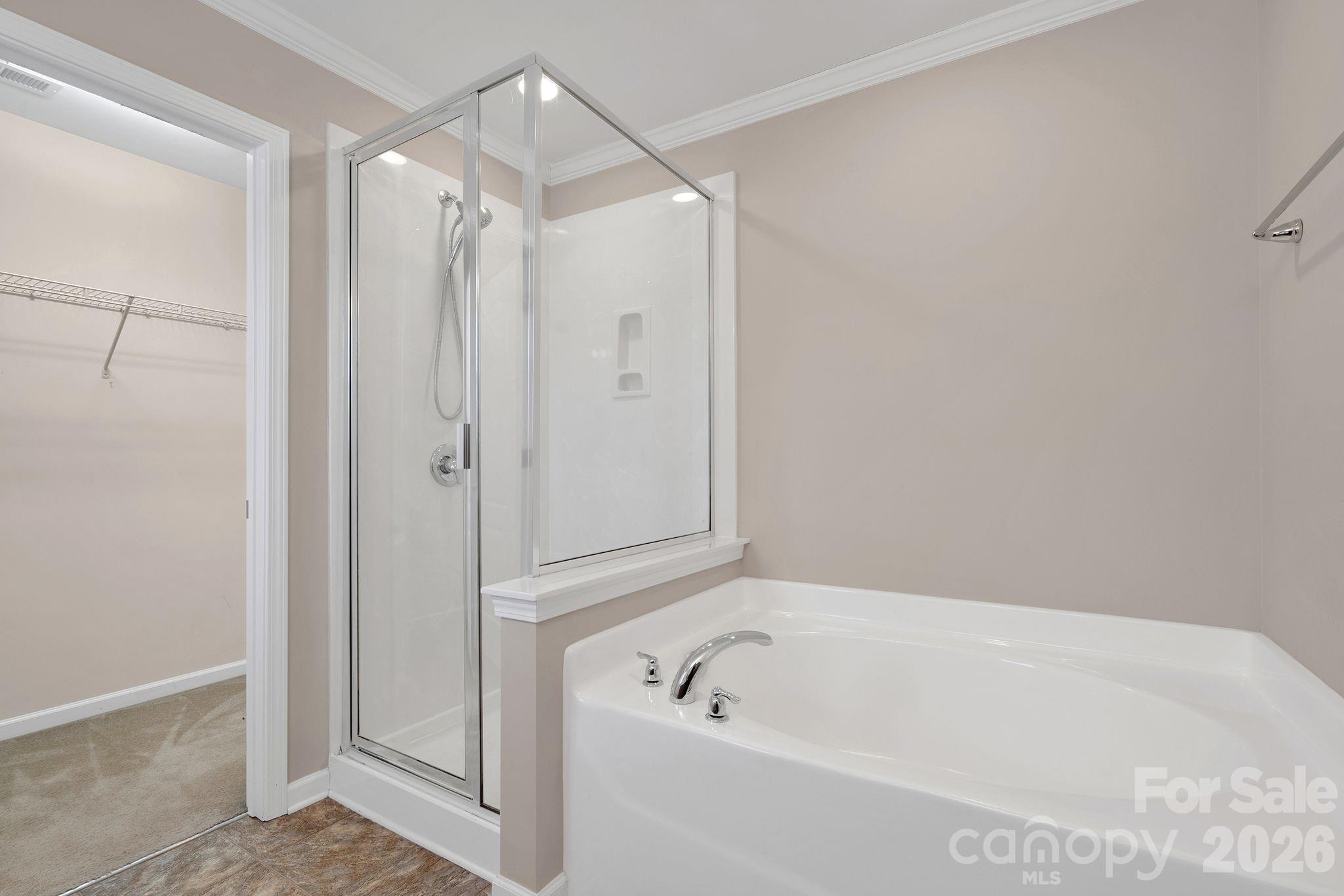 13718 Porter Creek Road Charlotte, NC 28262 - Photo 29 of 45 a bathroom with a tub a shower and a sink