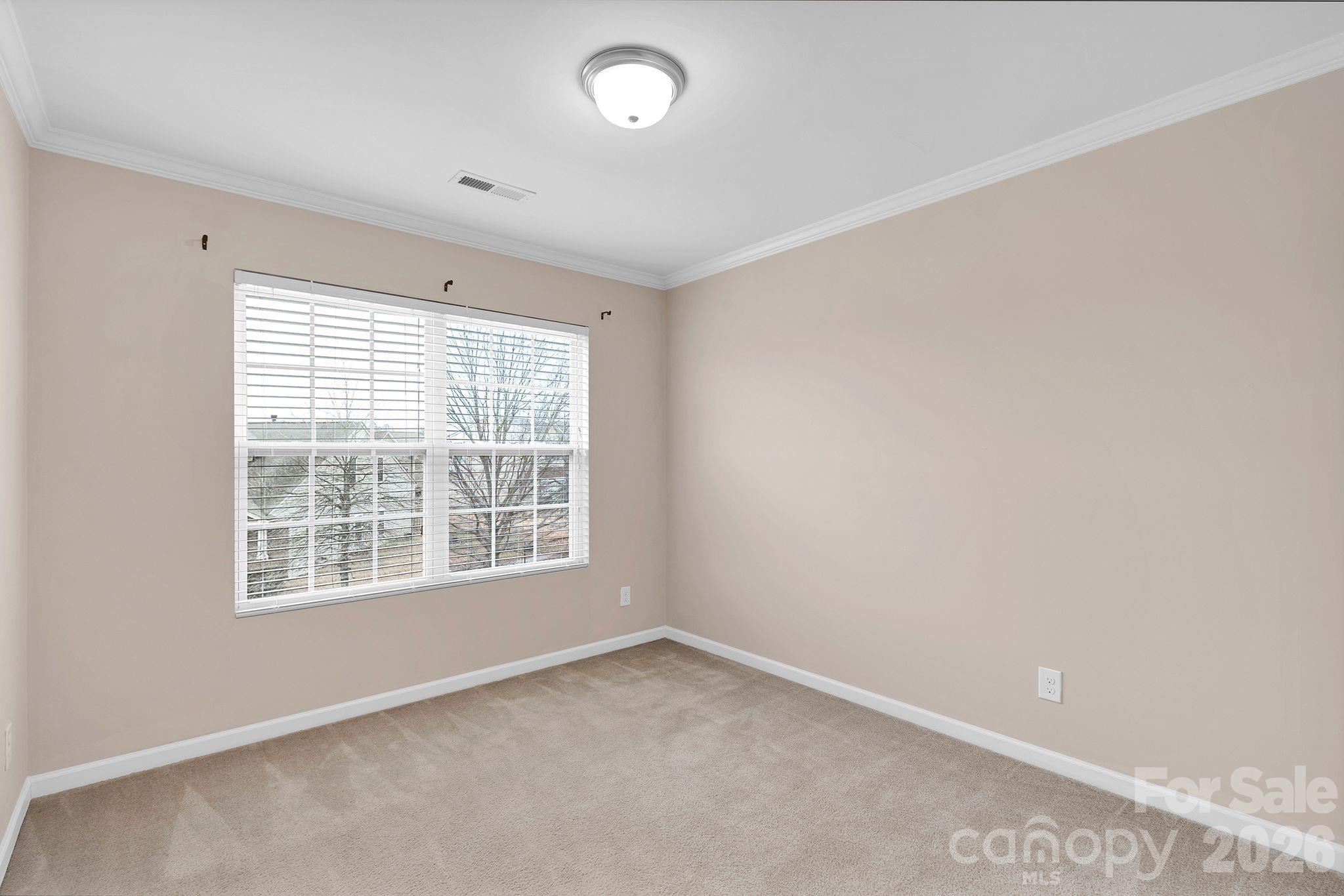 13718 Porter Creek Road Charlotte, NC 28262 - Photo 34 of 45 an empty room with a window