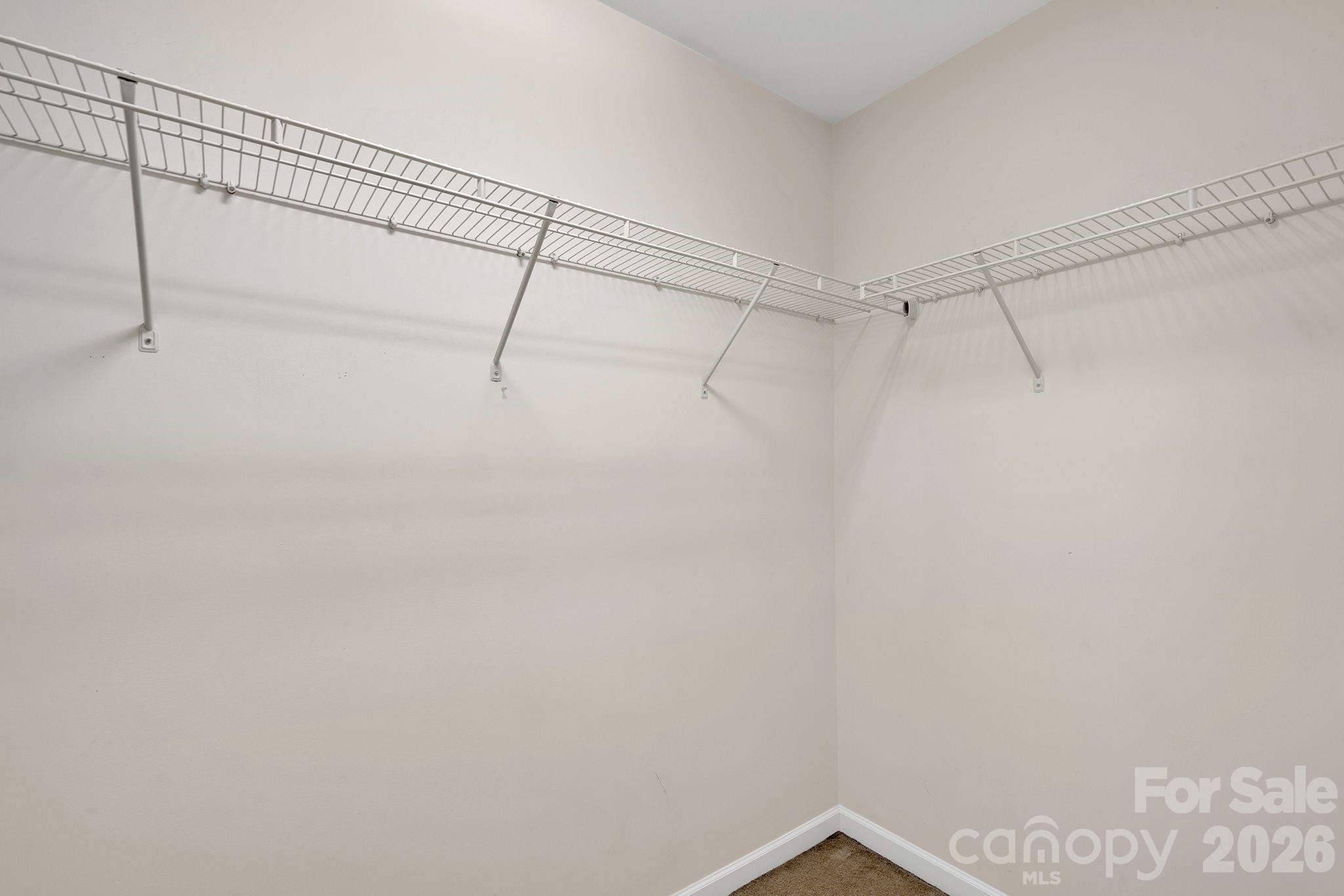 13718 Porter Creek Road Charlotte, NC 28262 - Photo 37 of 45 a view of a room with racks on the wall