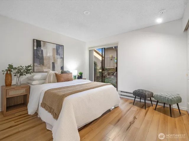 a bedroom with a bed and a table