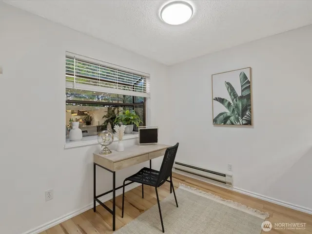 a dining room with furniture and window