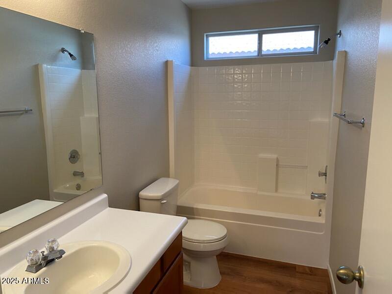 3233 West Abraham Lane Phoenix, AZ 85027 - Photo 11 of 13 a bathroom with a sink toilet and shower