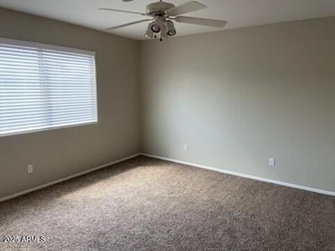 3233 West Abraham Lane Phoenix, AZ 85027 - Photo 8 of 13 an empty room with a window