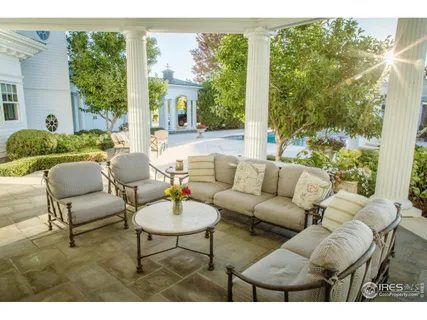 a picture of a living room with a floor to ceiling window and floor
