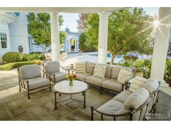 a picture of a living room with a floor to ceiling window and floor
