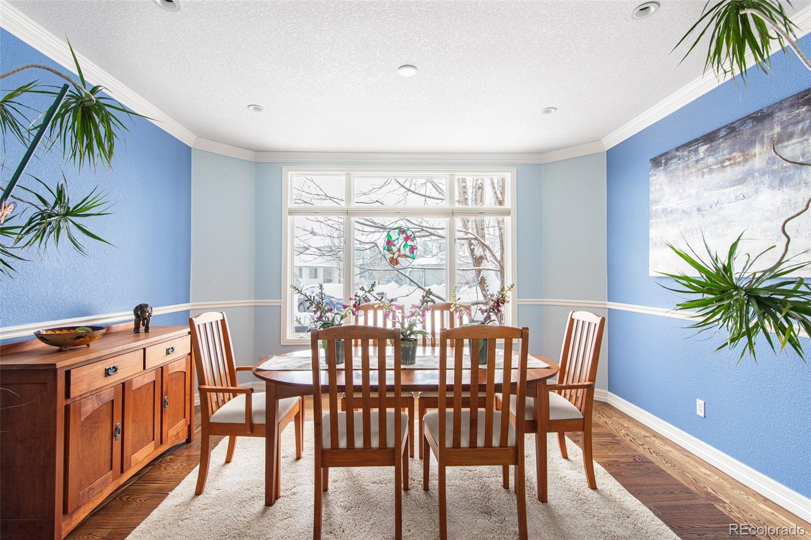 535 Sawtooth Point Lafayette, CO 80026 - Photo 15 of 40 a view of a dining room with furniture window and flowerpot