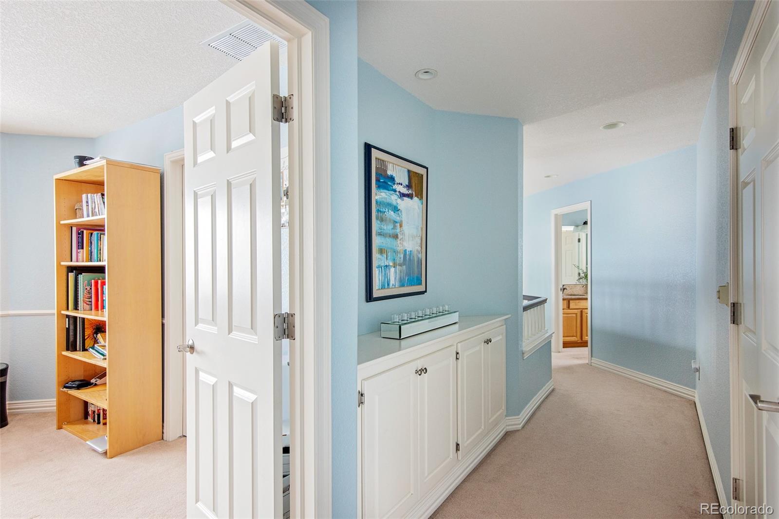 535 Sawtooth Point Lafayette, CO 80026 - Photo 23 of 40 a bathroom with a sink a mirror and a shower