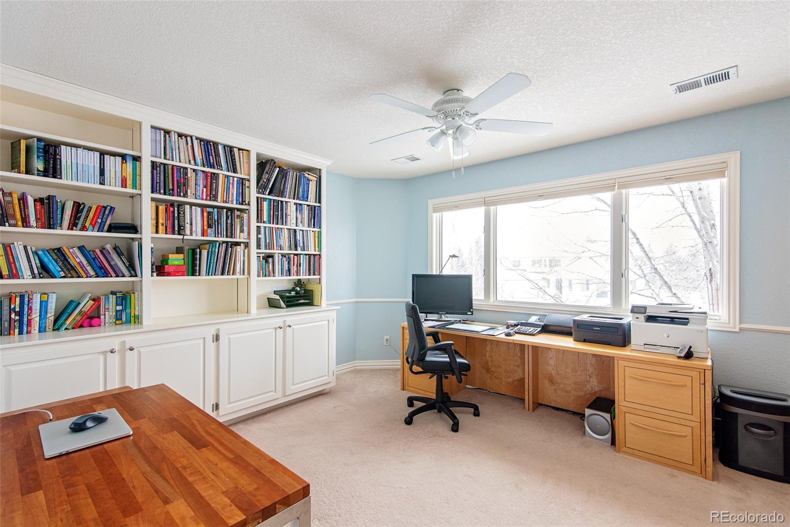 535 Sawtooth Point Lafayette, CO 80026 - Photo 24 of 40 a view of a workspace with furniture and a window
