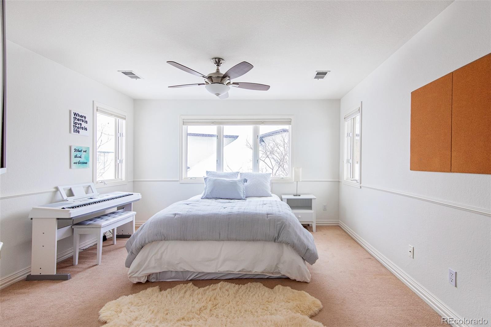 535 Sawtooth Point Lafayette, CO 80026 - Photo 27 of 40 a bedroom with a bed and a window