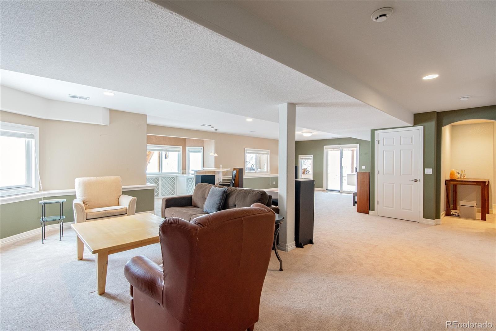 535 Sawtooth Point Lafayette, CO 80026 - Photo 31 of 40 a living room with fireplace furniture and a window