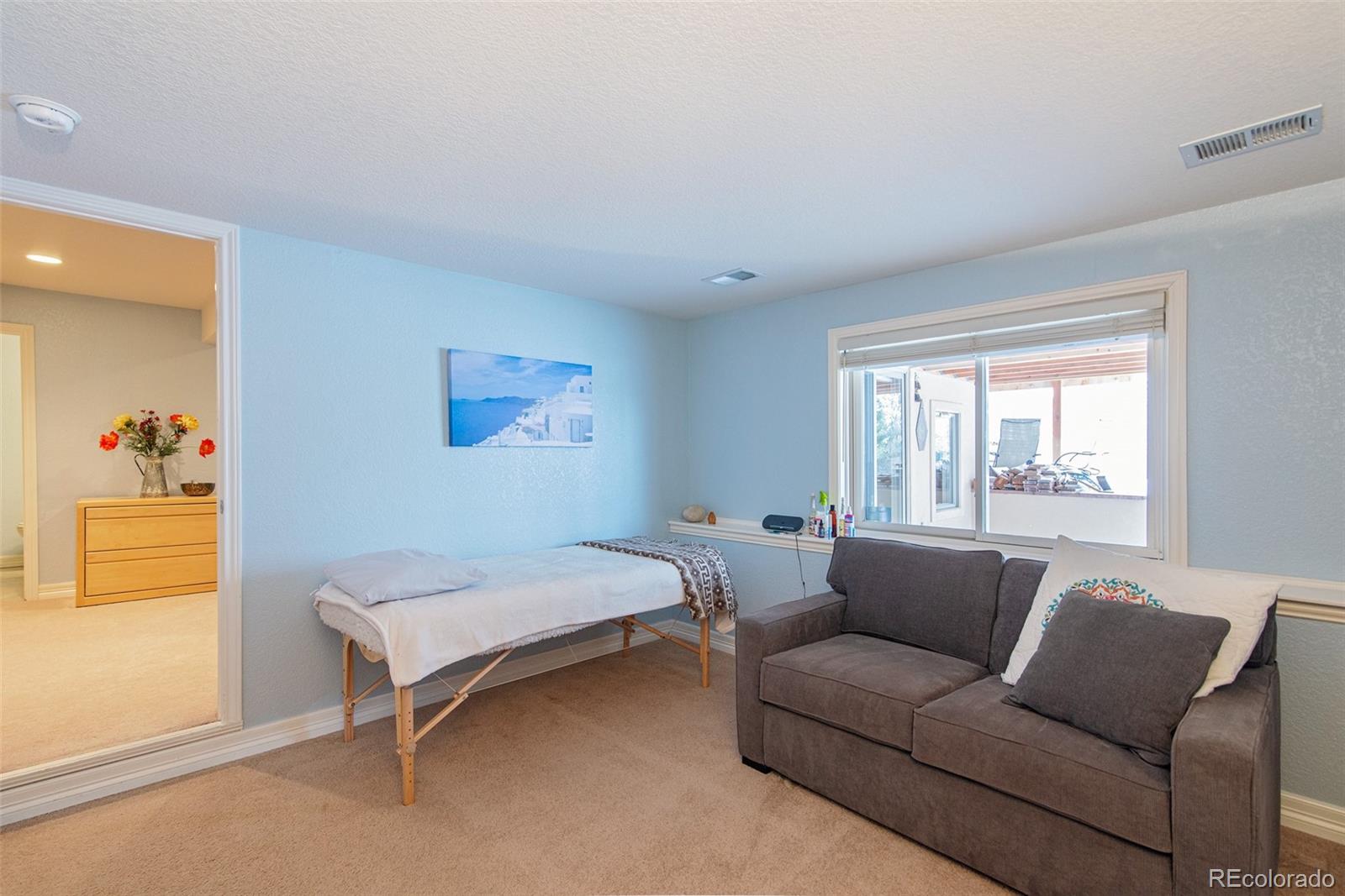 535 Sawtooth Point Lafayette, CO 80026 - Photo 34 of 40 a living room with furniture and a window