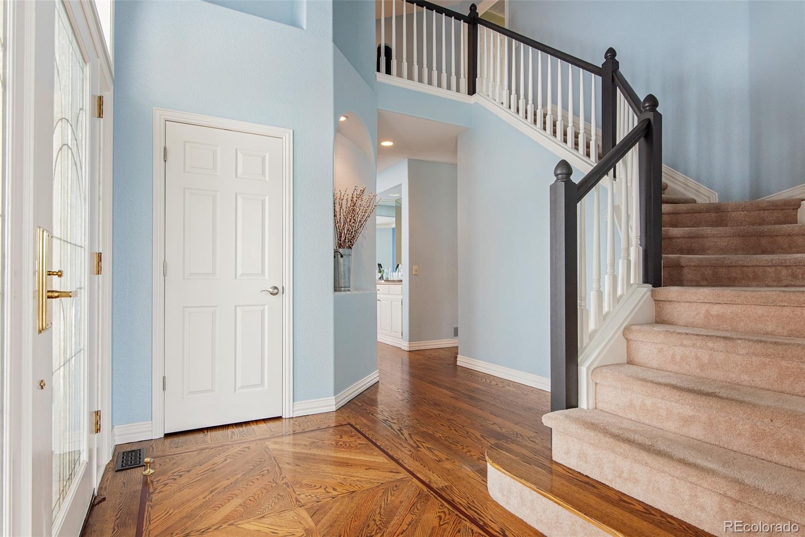 535 Sawtooth Point Lafayette, CO 80026 - Photo 4 of 40 a view of entryway and hall with wooden floor