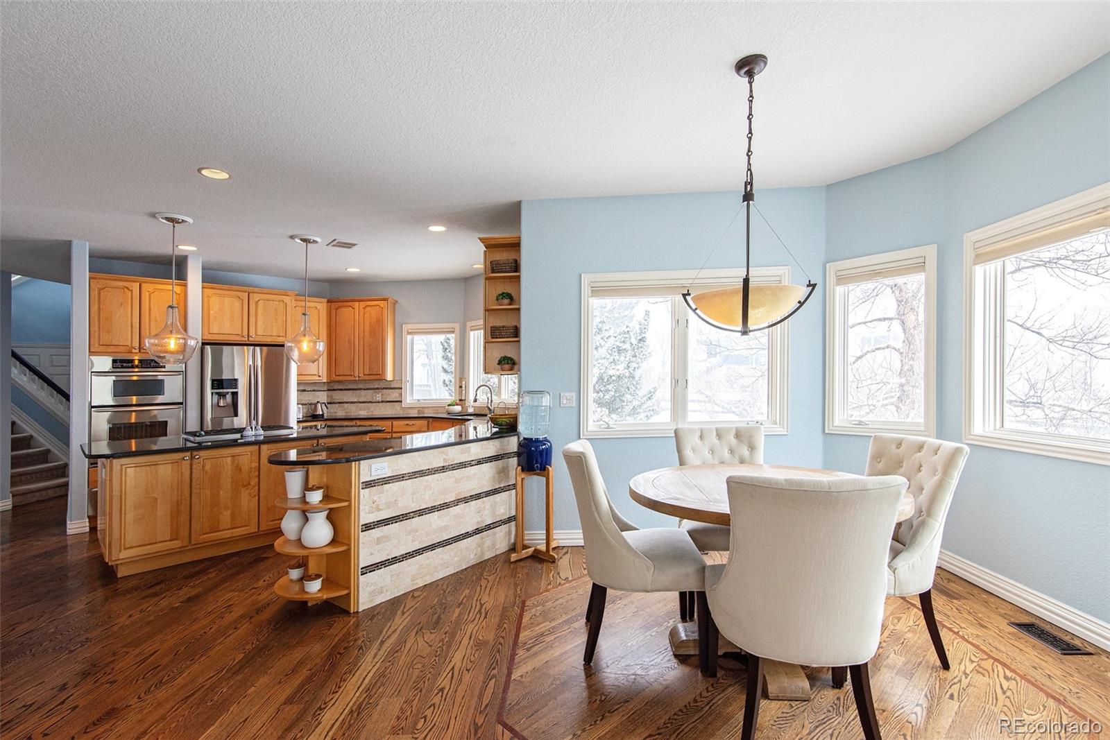 535 Sawtooth Point Lafayette, CO 80026 - Photo 9 of 40 a view of a dining room with furniture window and wooden floor